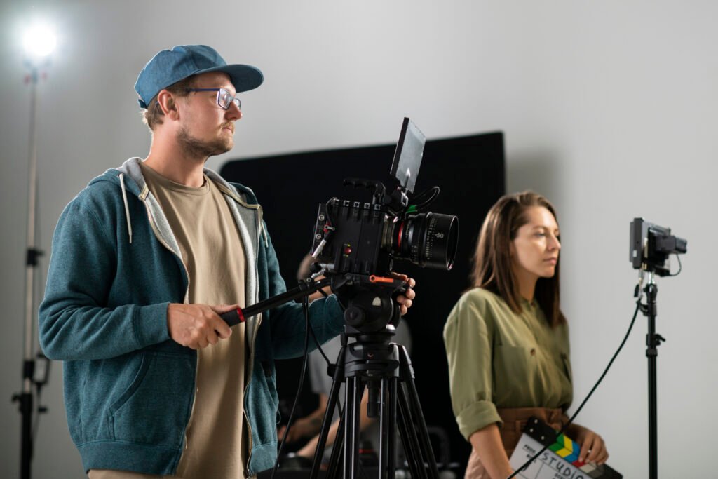 man filming with professional camera new movie
