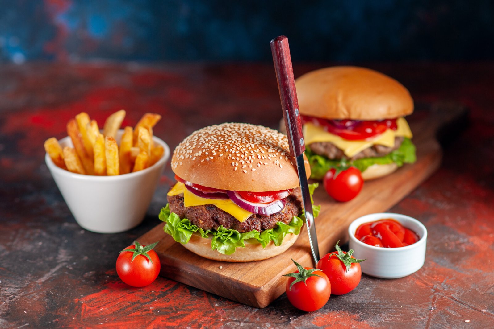front view delicious meat cheeseburger with french fries cutting board dark background fast food meal snack dinner dish sandwich scaled